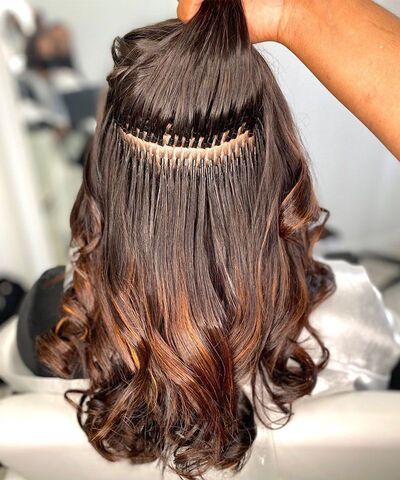 Long wavy hair extensions with smooth blending at SD Luxury Salon by Sajid
