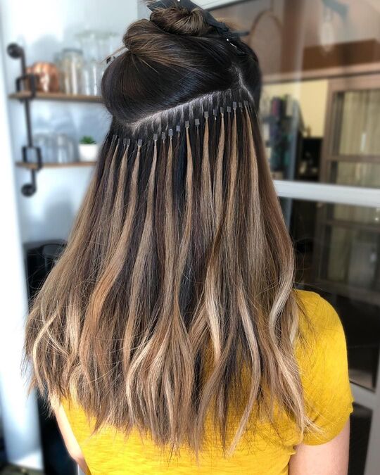Hair extension fitting process with natural blending at SD Luxury Salon by Sajid Janakpuri